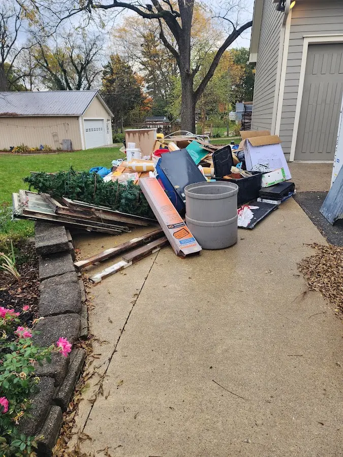 Dumpster being loaded with debris for Roofing Dumpster Rental in Jeannette